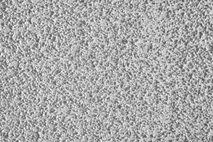 Close-up of a textured popcorn ceiling surface showing why spring is a good time for popcorn ceiling removal in Whitby homes