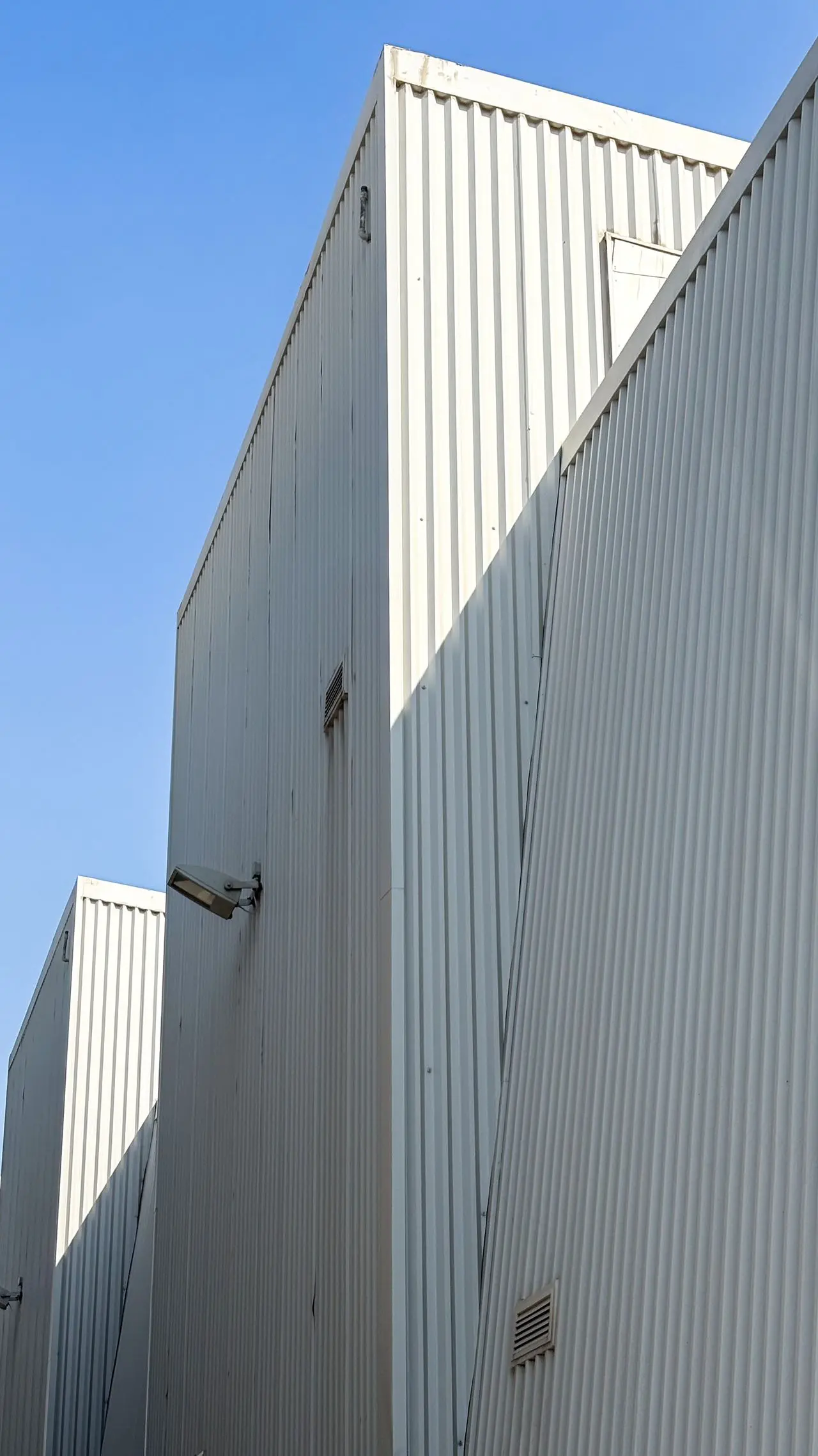 Corrugated metal siding on commercial building in Whitby, ON